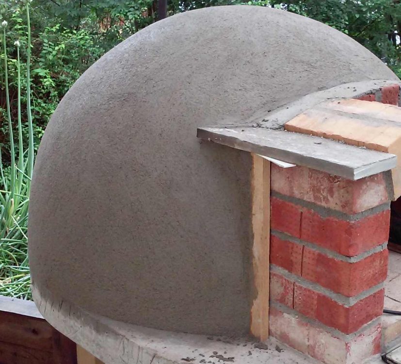 first coat of render on wood fired pizza oven dome