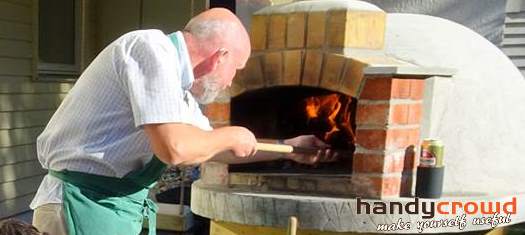 Wood fired pizza oven in action and yes, that's me!