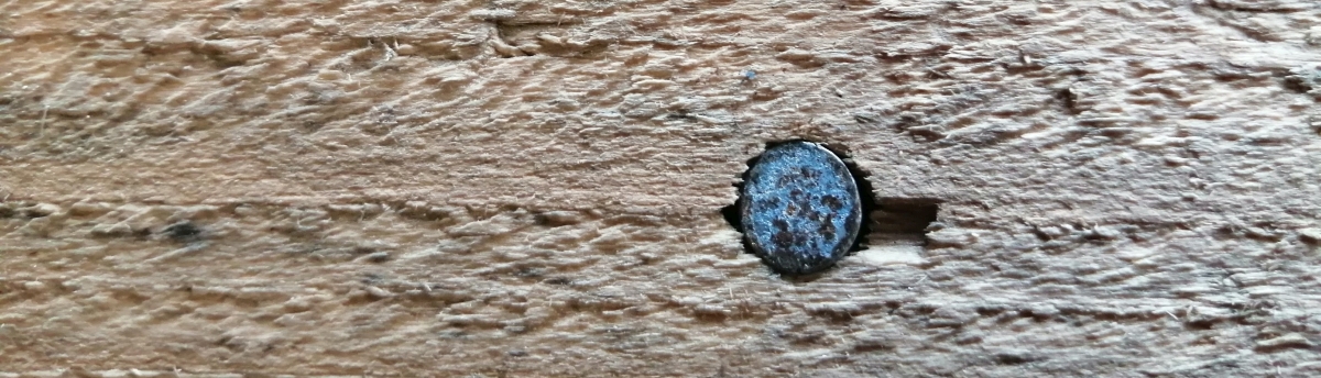 a nail in a plank getting nails out